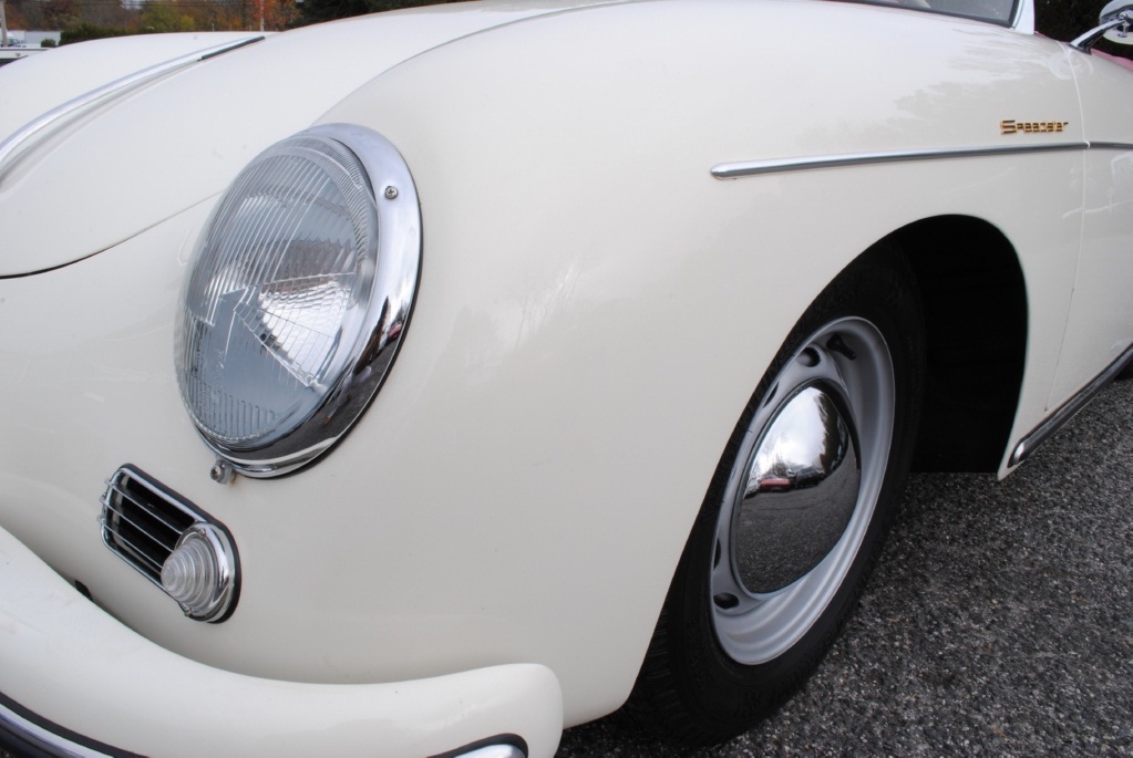 1957 Porsche 356A Speedster collector car in Speedster White, matching numbers, rebuilt engine, restored red leather interior, and clean detailing.