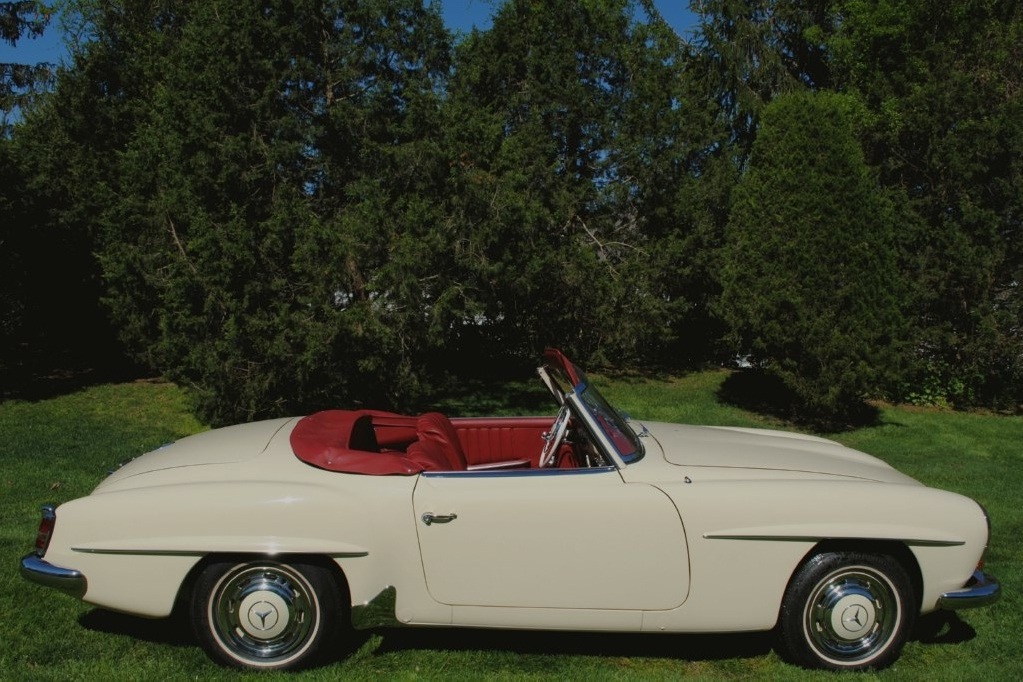 Meticulously rebuilt 1959 Mercedes-Benz 190SL Roadster, finished in original DB608 Ivory, featuring all new chrome, rubber, and a new soft top.