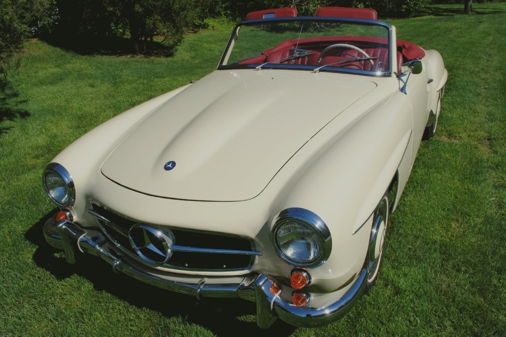 Impeccable 1959 Mercedes-Benz 190SL Roadster, rare factory Ivory exterior, fresh soft top, rebuilt drivetrain, and show-quality presentation.