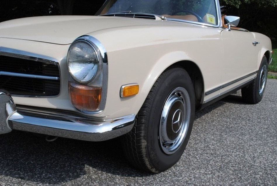 Classic 1971 Mercedes-Benz 280SL convertible restored with German square weave carpet and refinished wood dash.
