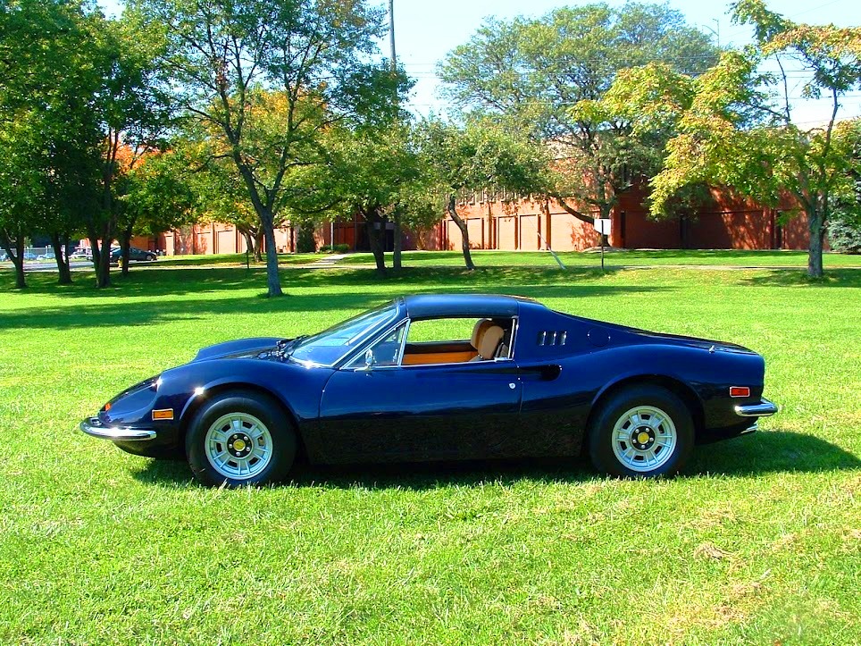 Vintage Ferrari 246 GTS Dino convertible from 1974 in classic blue with fully rebuilt suspension and correct interior trim refinishing.